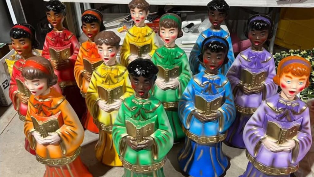 display of airbrushed blow mold Christmas carollers