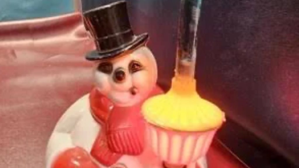 Famous NOMA Snowman holding bubble light